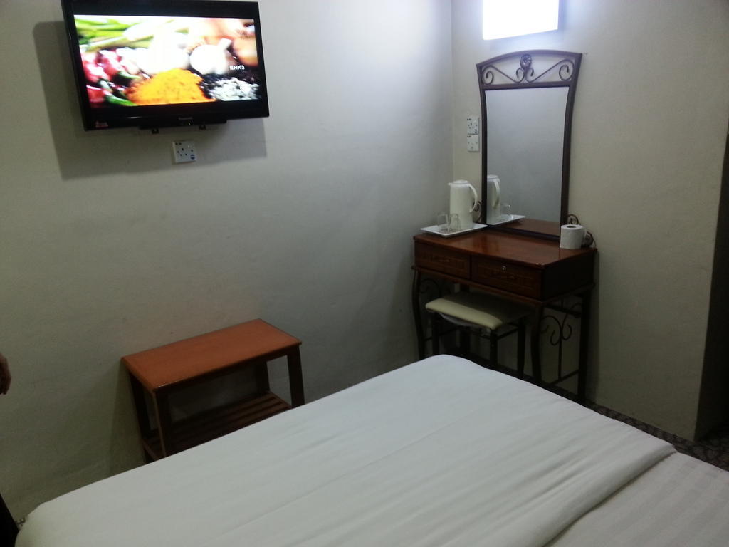 Oriental Inn Kuching Rom bilde