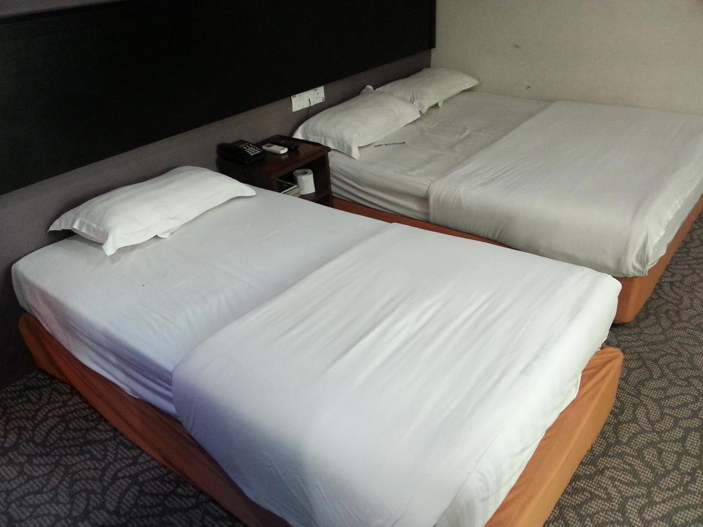 Oriental Inn Kuching Rom bilde