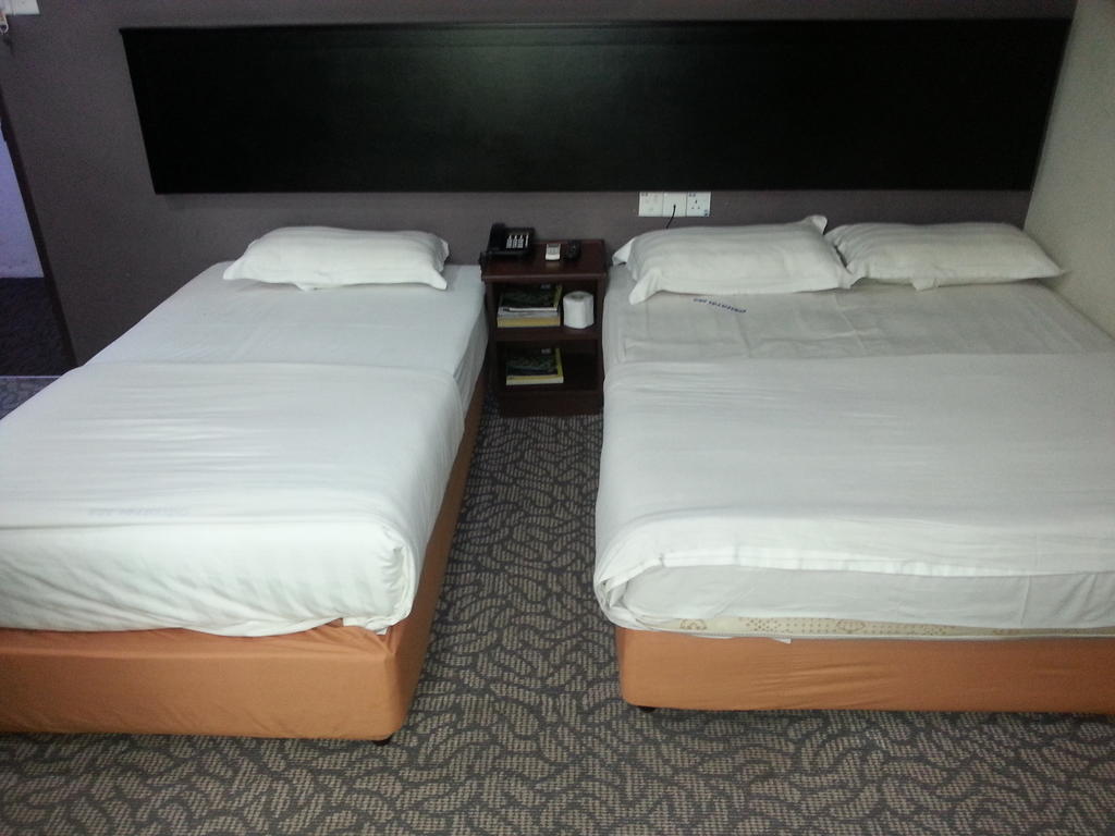 Oriental Inn Kuching Rom bilde