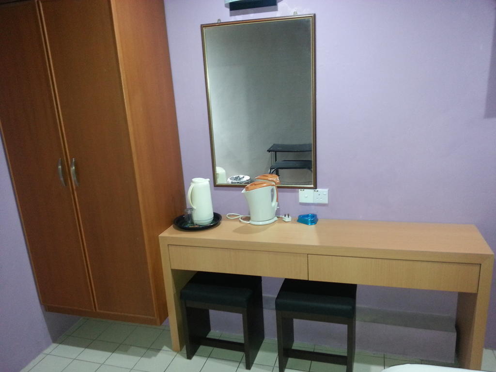 Oriental Inn Kuching Rom bilde